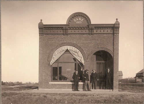 Old exterior photo from the founding of Cornhusker Bank