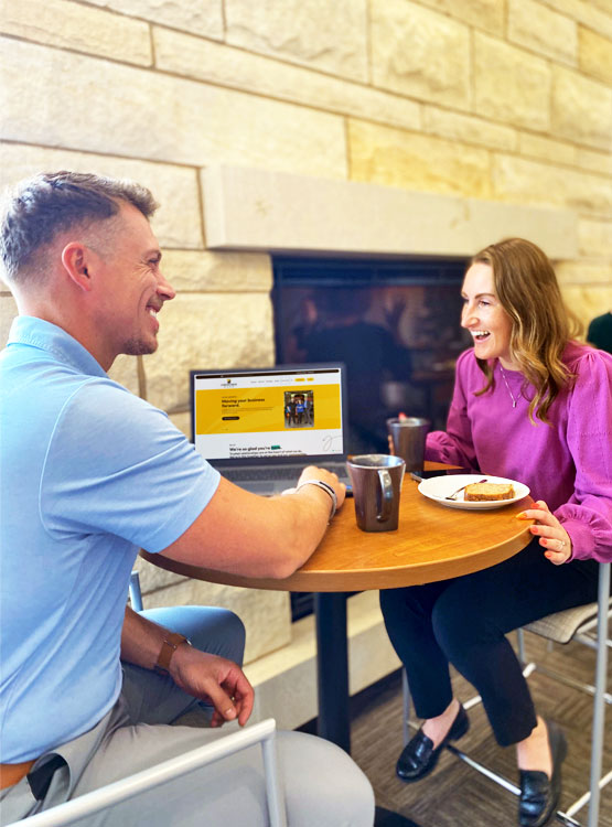 Cornhusker Bank employee showing a client the Cornhusker Bank site