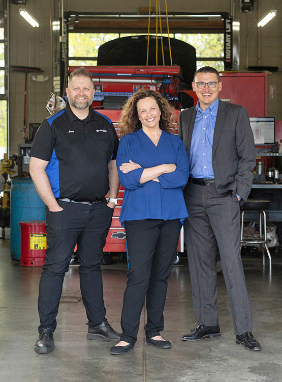 inMOTION Auto owners posing with Cornhusker Member
