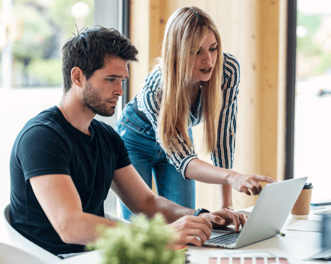 Couple looking at their laptop